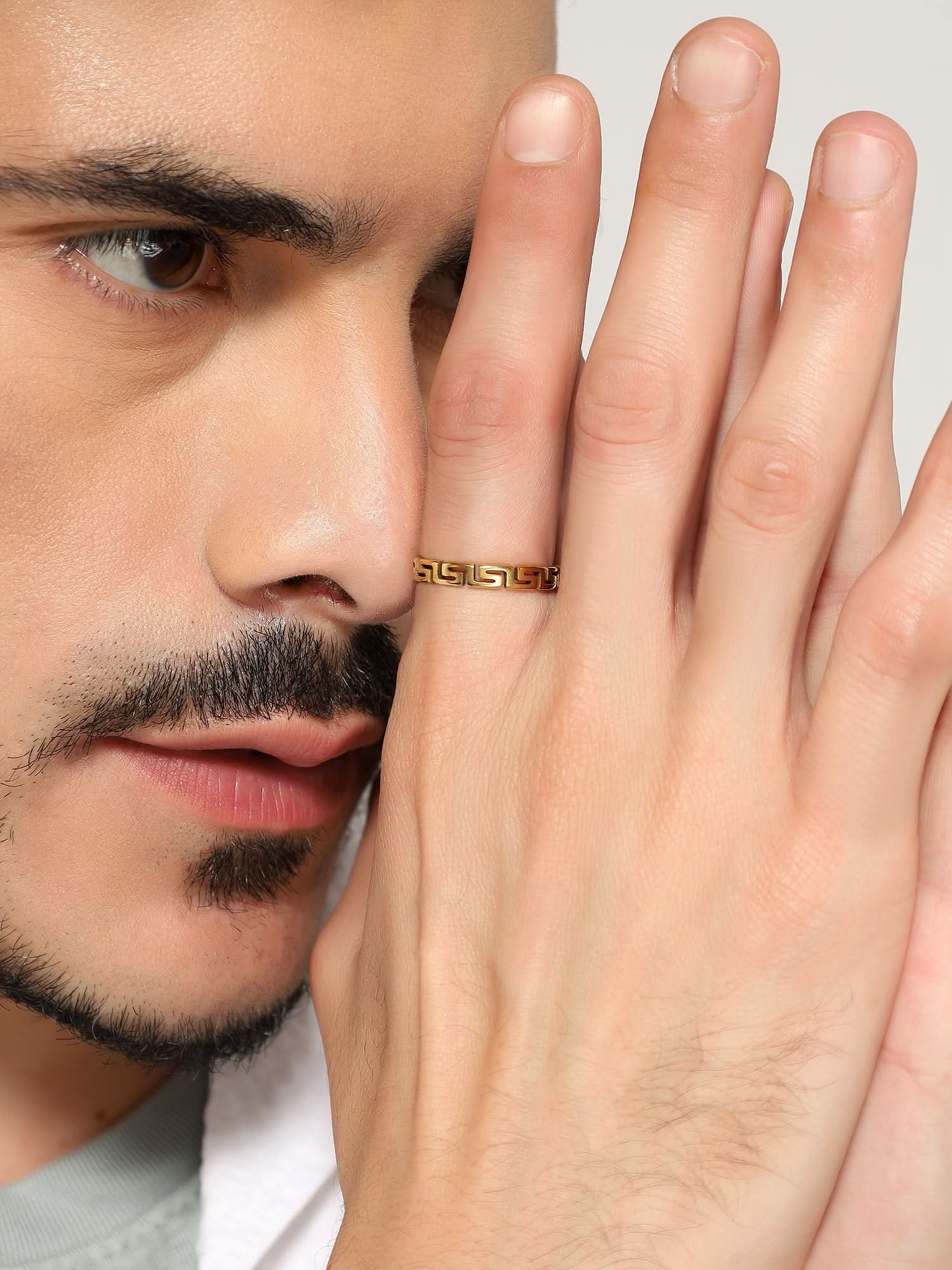 Model wearing Cutting Designer Ring in gold — men's gold ring styled on hand