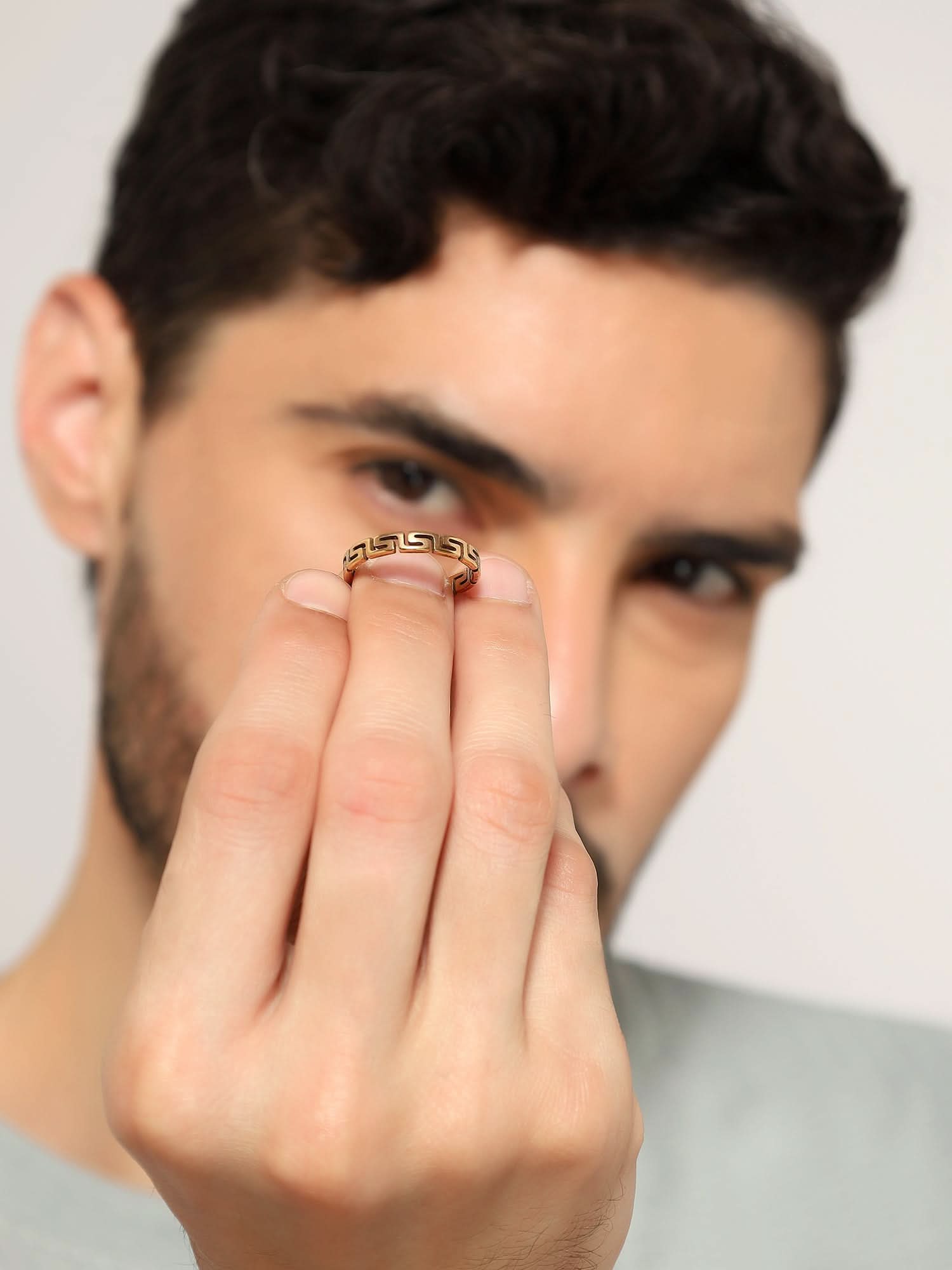 Model wearing Cutting Designer Ring in gold — men's gold ring styled on hand