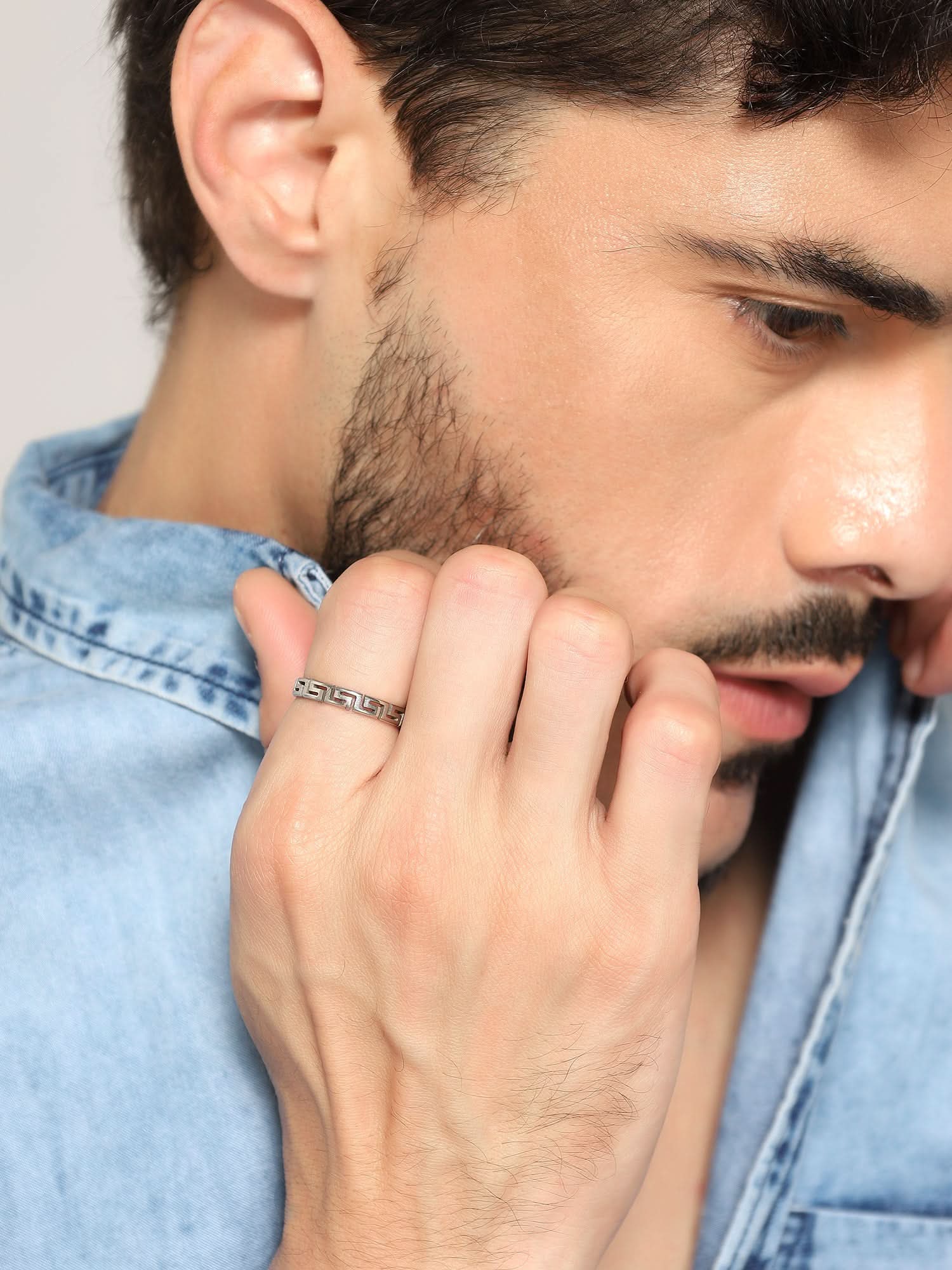 Model wearing Cutting Designer Ring in silver — men's silver ring styled on hand