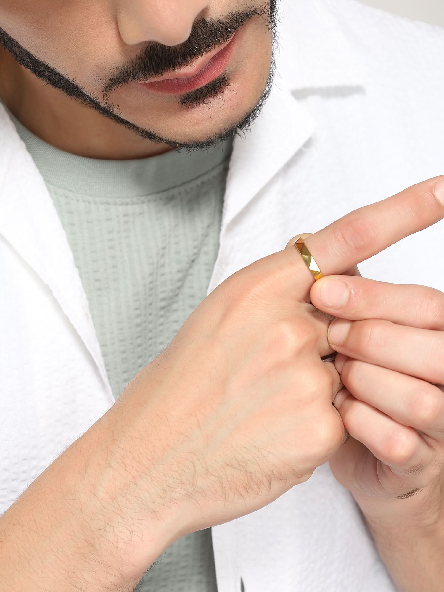 Model wearing Cross Versatile Ring in gold — men's gold ring styled on hand