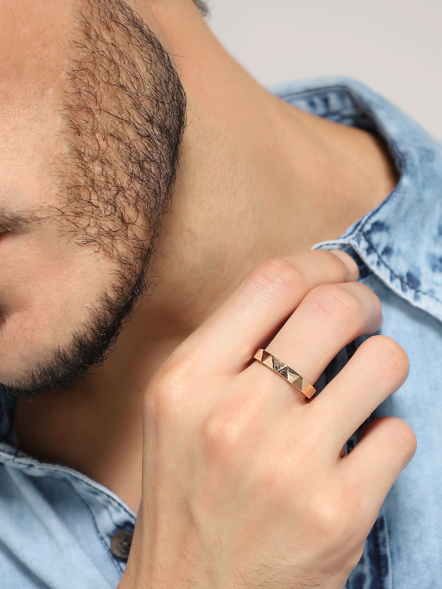 Model wearing Cross Versatile Ring in rose gold — men's rose gold ring styled on hand