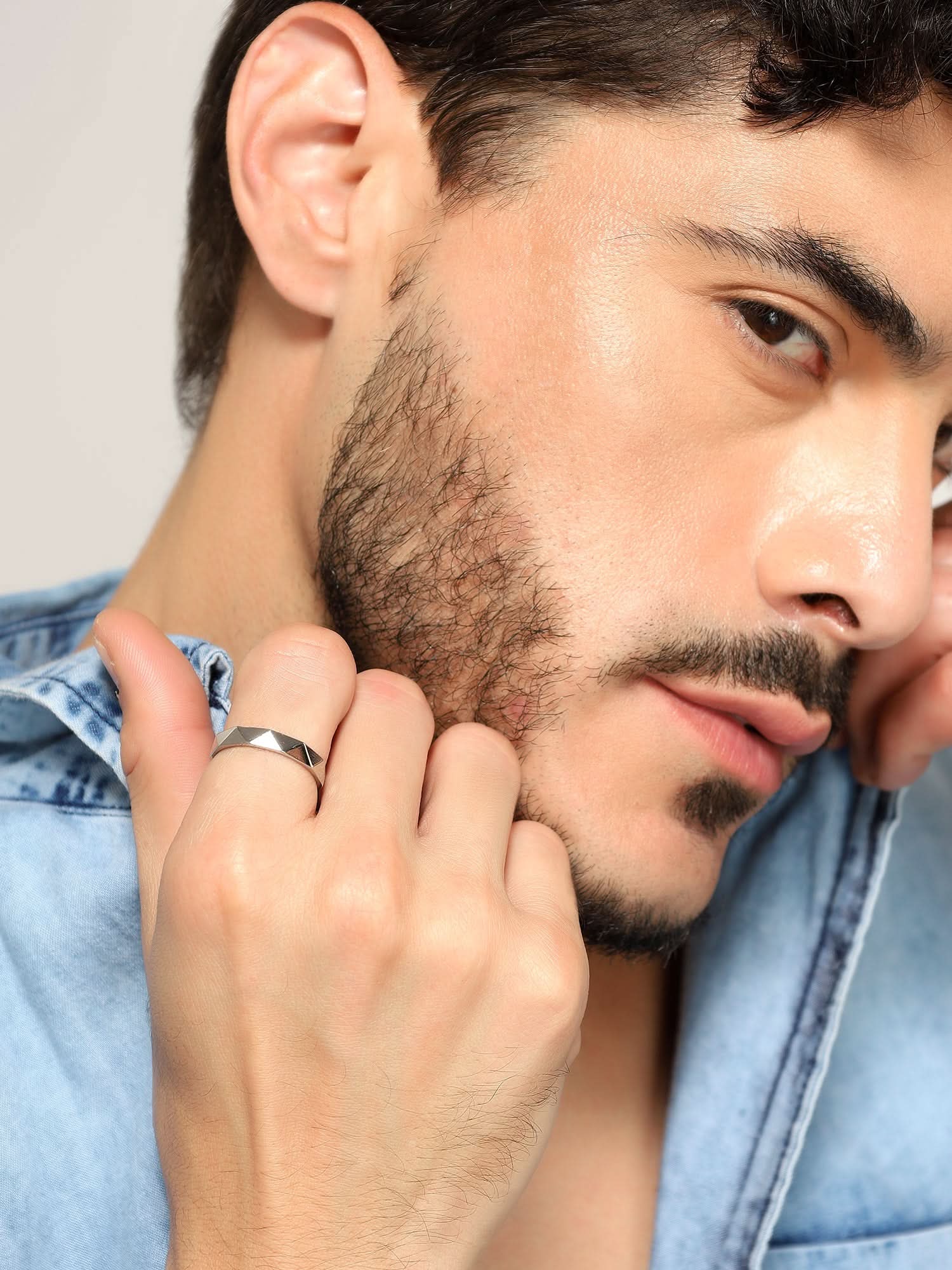 Model wearing Cross Versatile Ring in silver — men's silver ring styled on hand