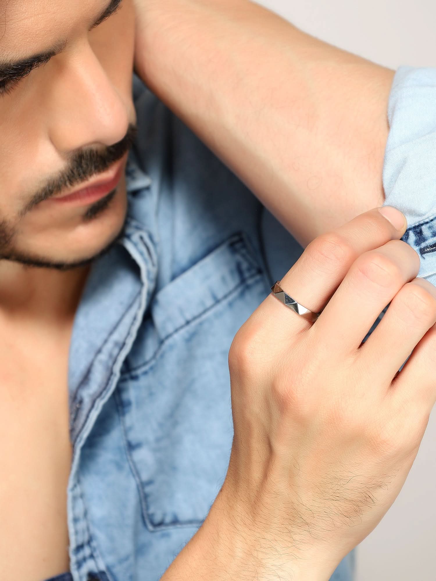 Model wearing Cross Versatile Ring in silver — men's silver ring styled on hand