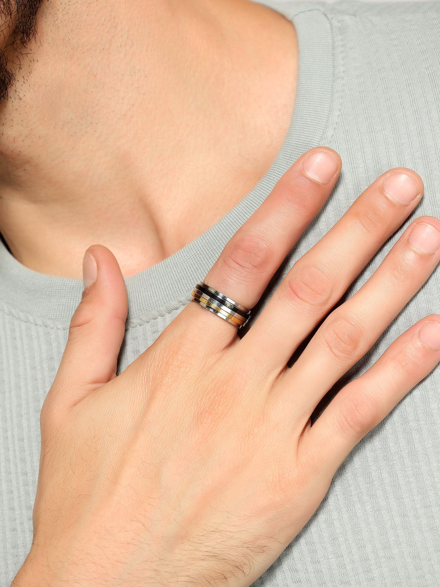 Model wearing Regal Crest Signet Ring in gold — men's gold ring styled on hand