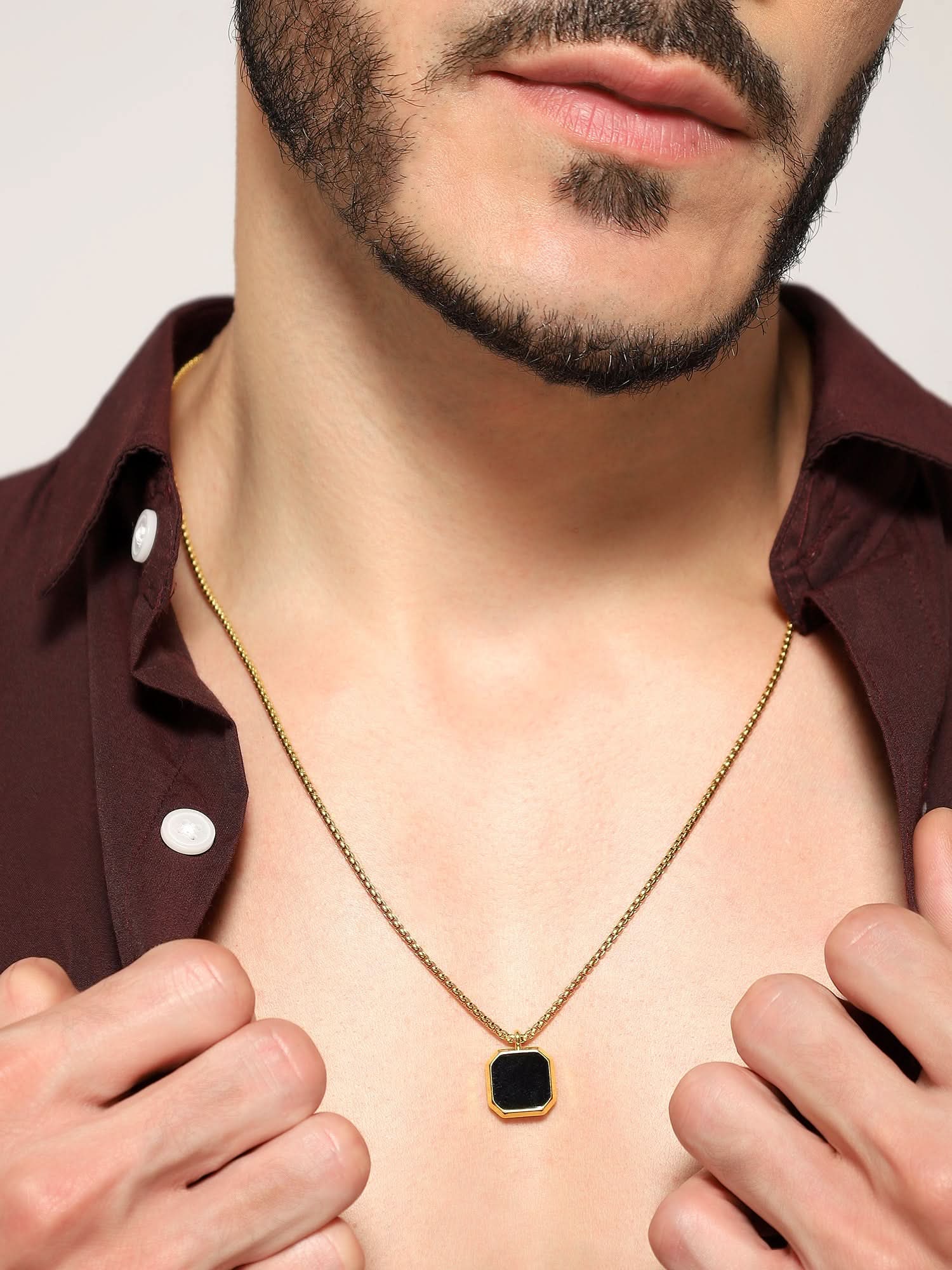 Model wearing Cuban Box Chain Enamel Square Pendant in gold — men's gold pendant styled on hand