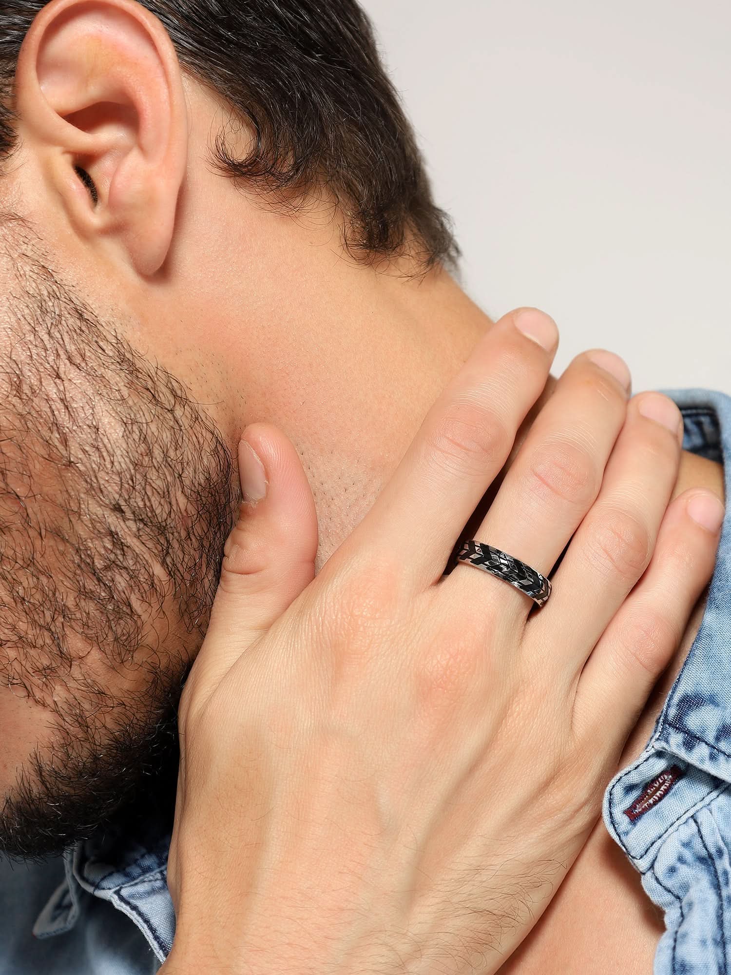 Model wearing Tyre Pattern Ring in silver — men's silver ring styled on hand